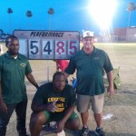 Eldred Henry, center, with Omar Jones and Coach Tony Dougherty 
