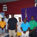 (l-r) BVIOC Secretary General, Lloyd Black, athletics coaches, Winston Potter, and Karl Scatliffe, Shot Put and Discus throw athlete, Eldred Henry, 100m and 200m sprinter Shaquoy Stephens, BVIOC President, Ephraim Penn, Assistant Director Department of Youth Affairs and Sports, Paul Hewlett, Chef de Mission Xx Commonwealth Games, Mark Chapman.