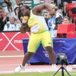 Eldred Henry throws the Shot Put a distance of 17.08 
