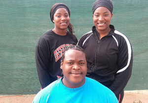 Central Arizona College's Tynelle Gumbs, left, Trevia Gumbs and Eldred Henry established records in the Weight Throw and Shot Put events respectively.  Photo:  Tony Dougherty